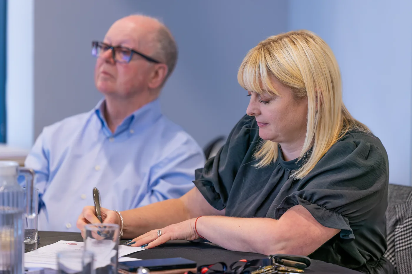 RentLocally team members taking notes at a property management conference